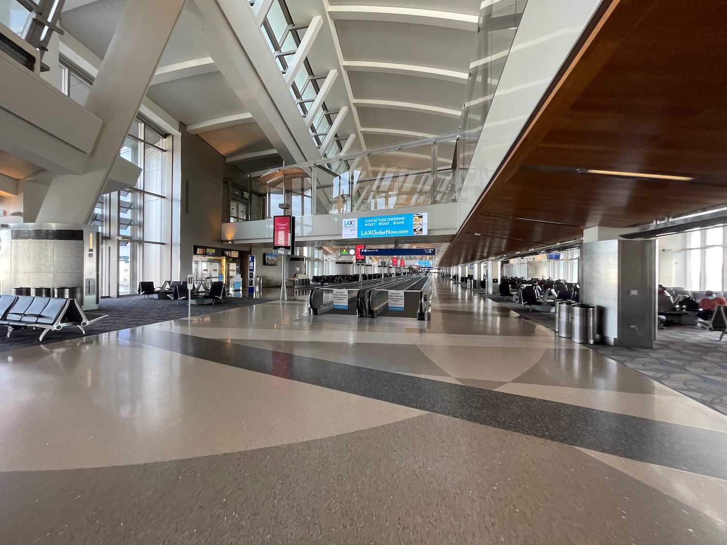 an airport with luggage in the terminal