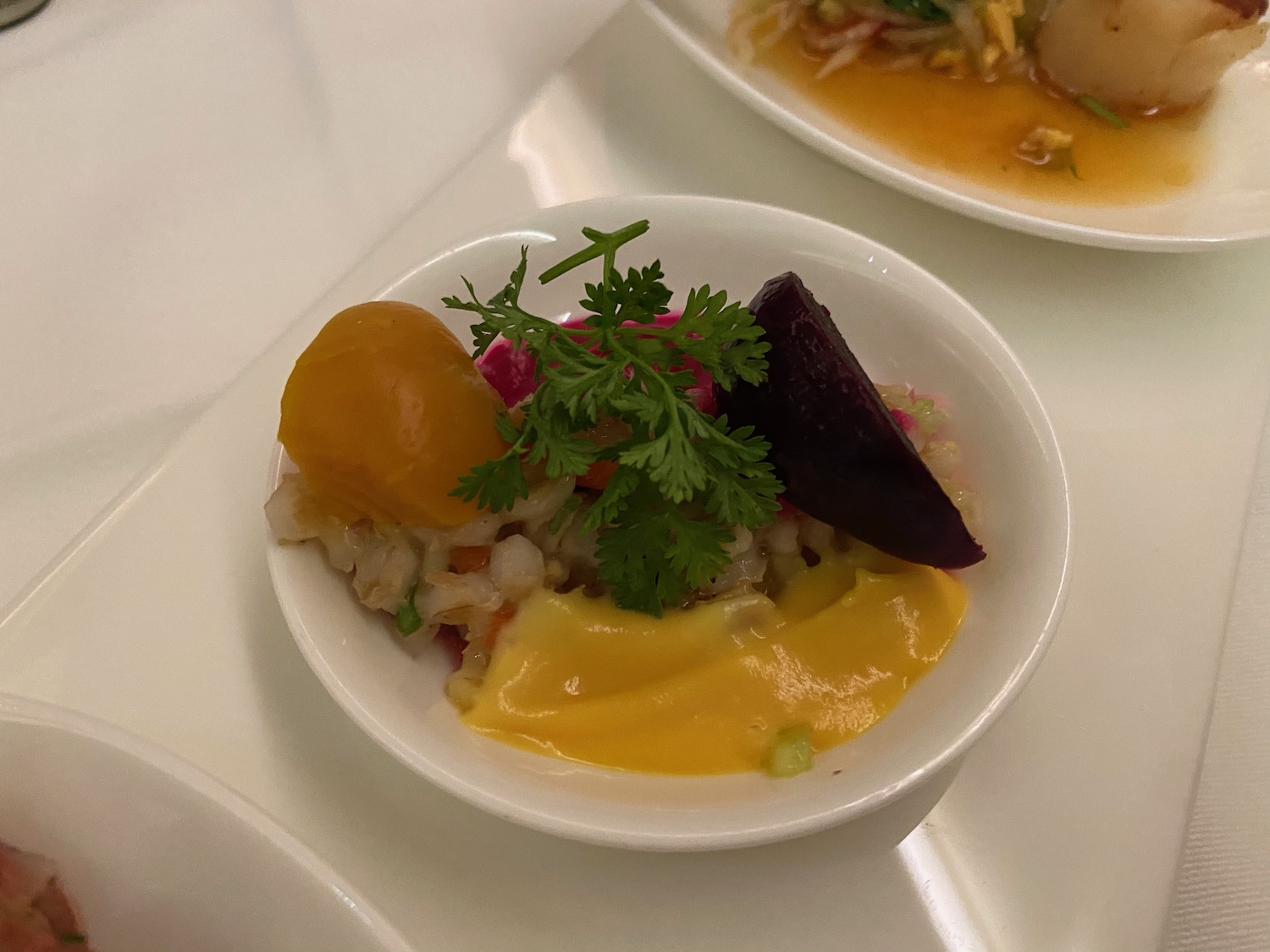 a bowl of food on a white plate