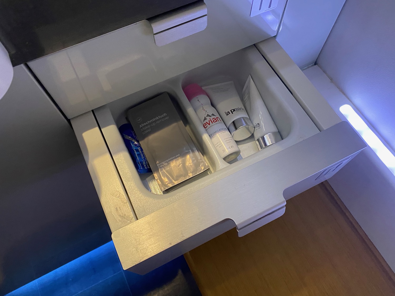 a drawer with a few toiletries in it