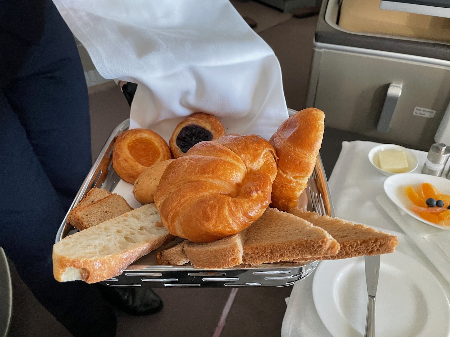 a basket of bread and pastries