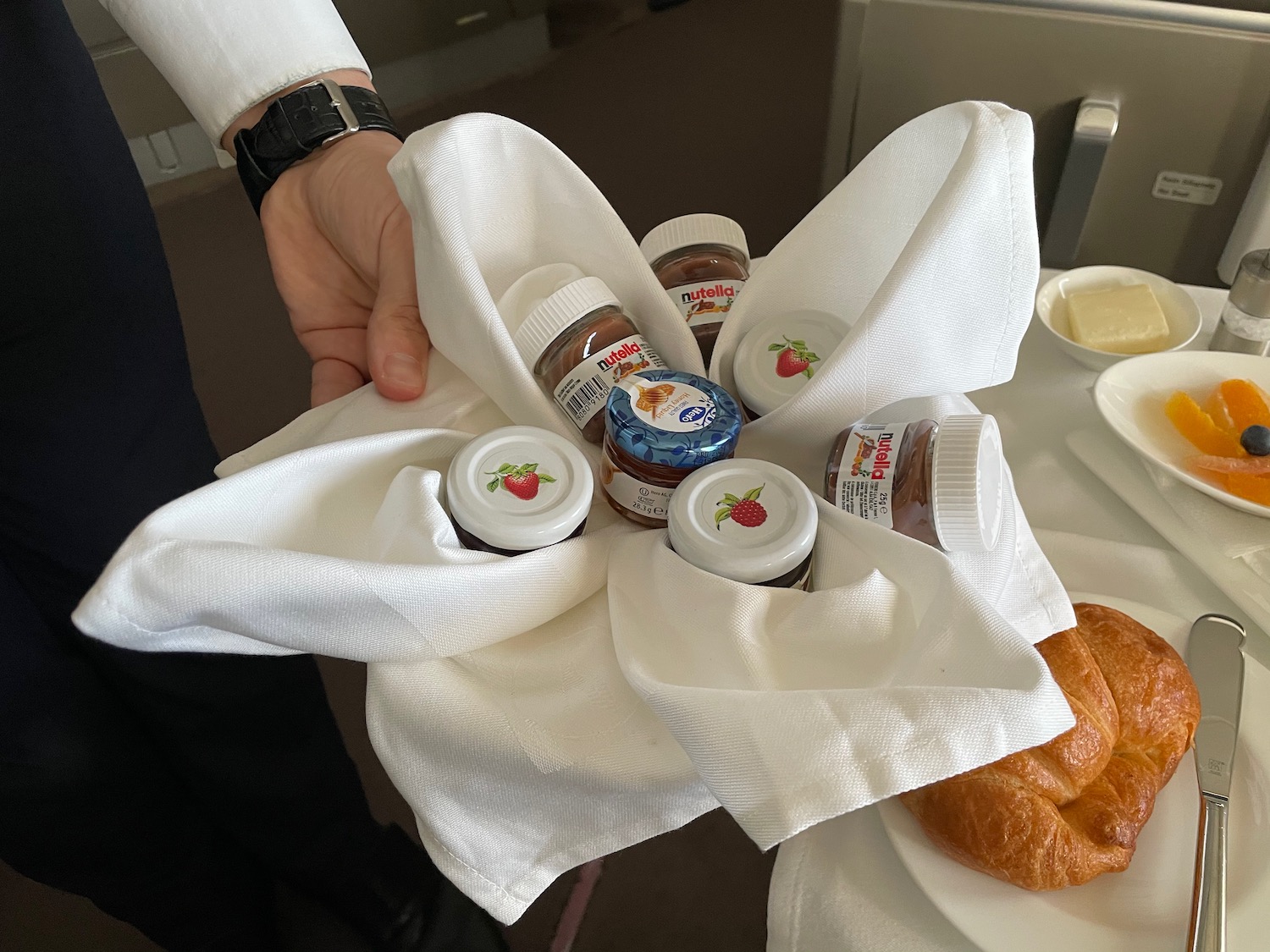 a hand holding a napkin with food on it