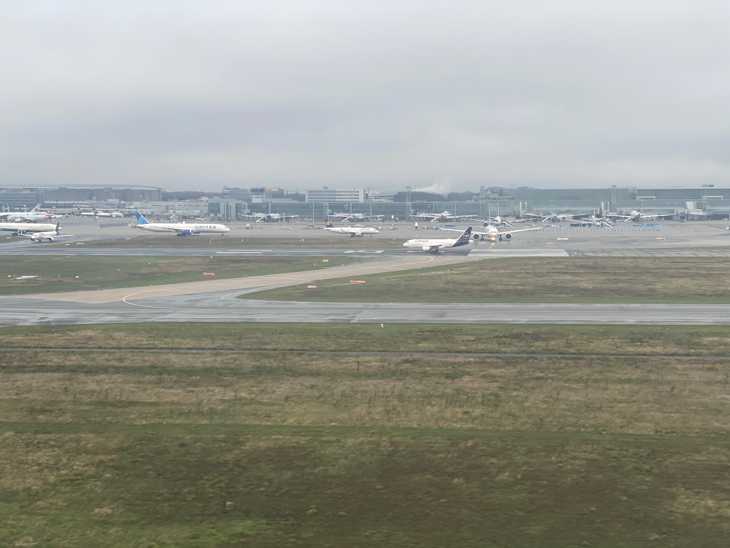 an airport with airplanes on the runway