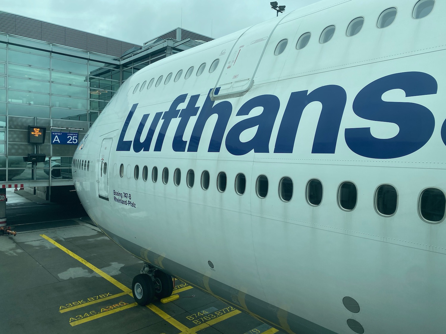 a large white airplane with blue writing on it