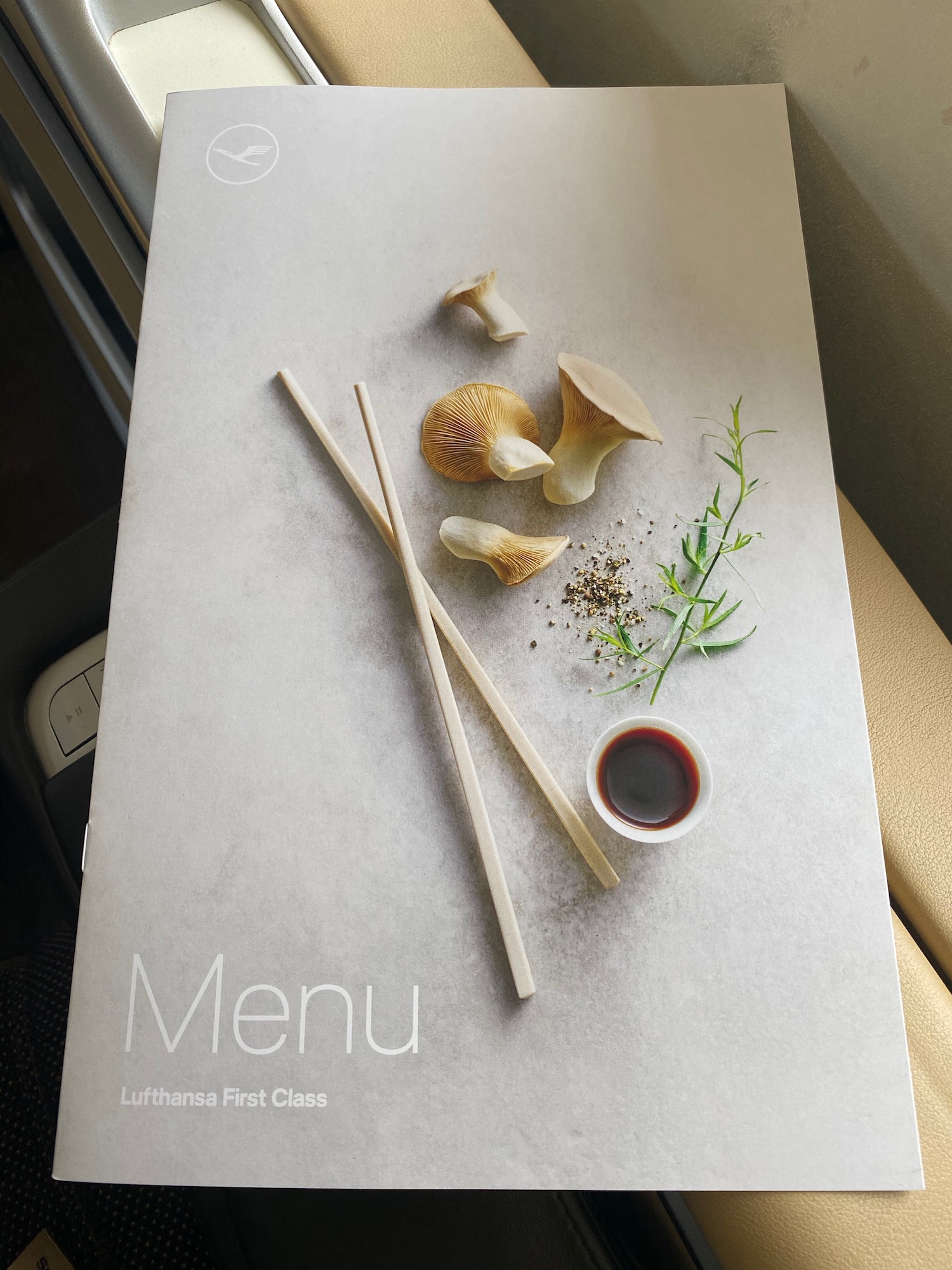a menu with mushrooms and chopsticks