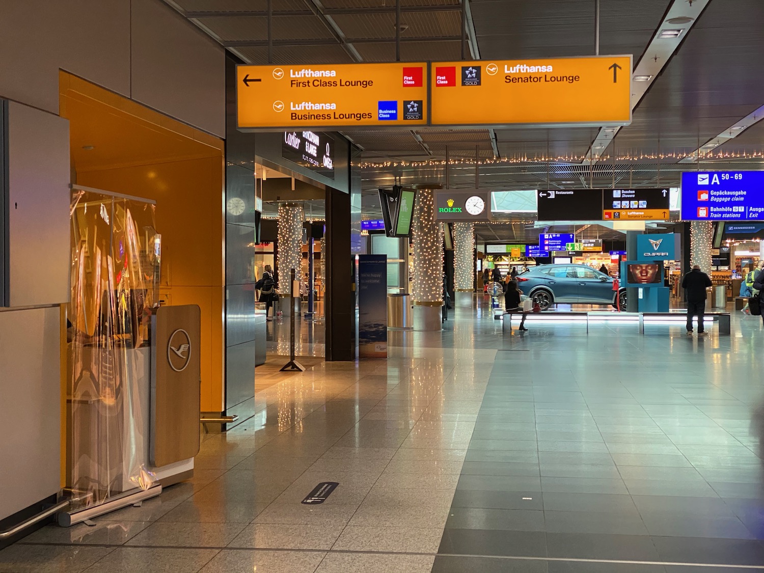 a yellow sign in a airport