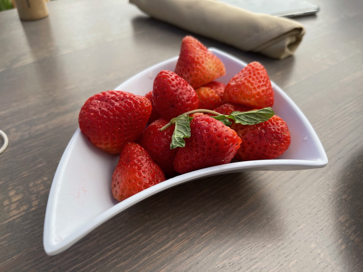 a bowl of strawberries on a table