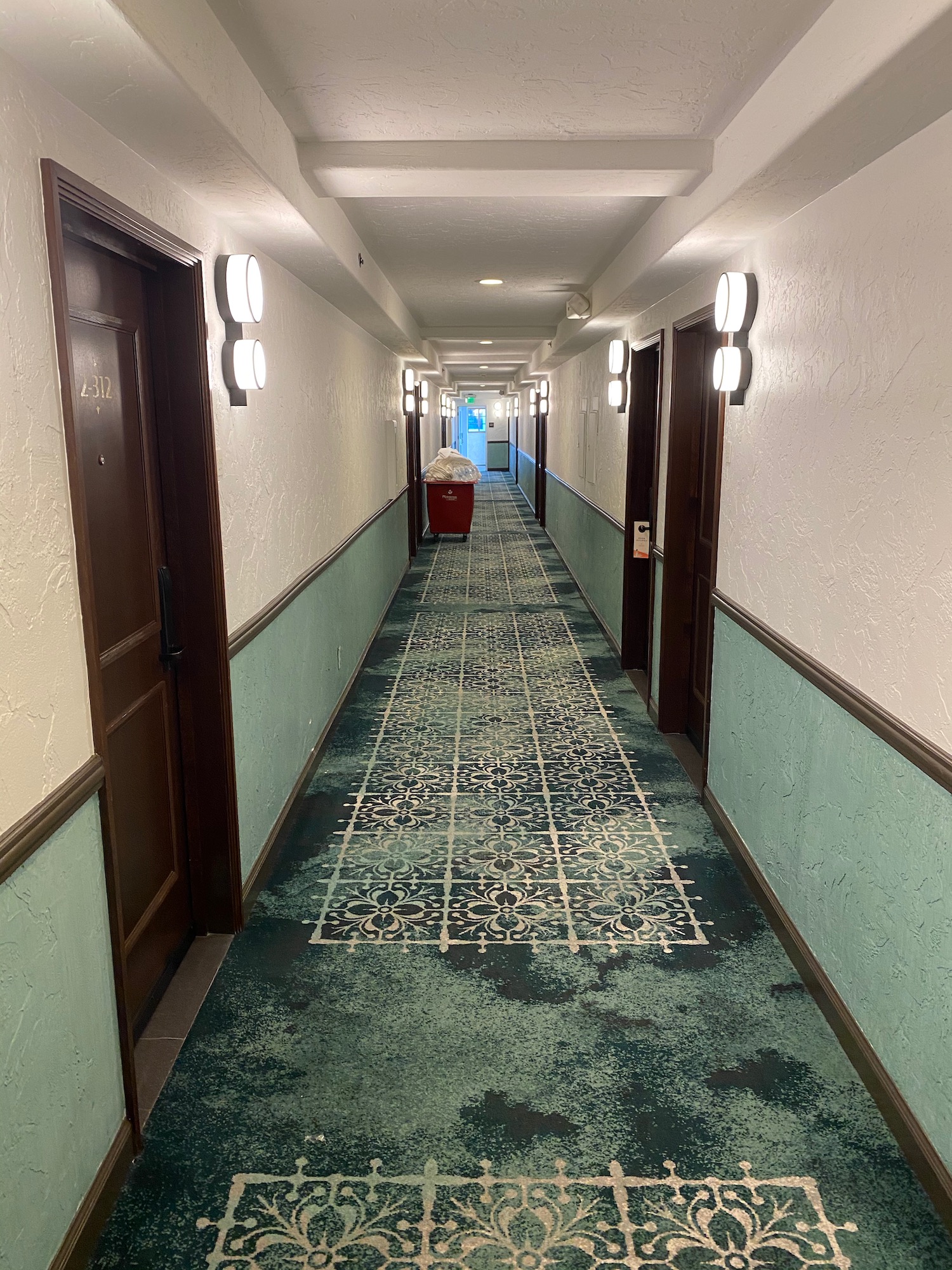 a hallway with a carpeted floor