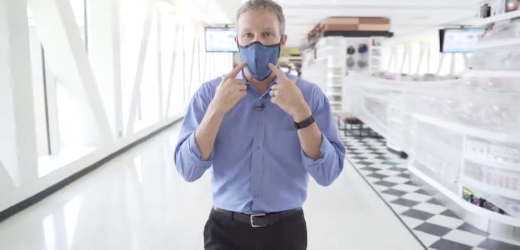 a man wearing a blue shirt and blue shirt