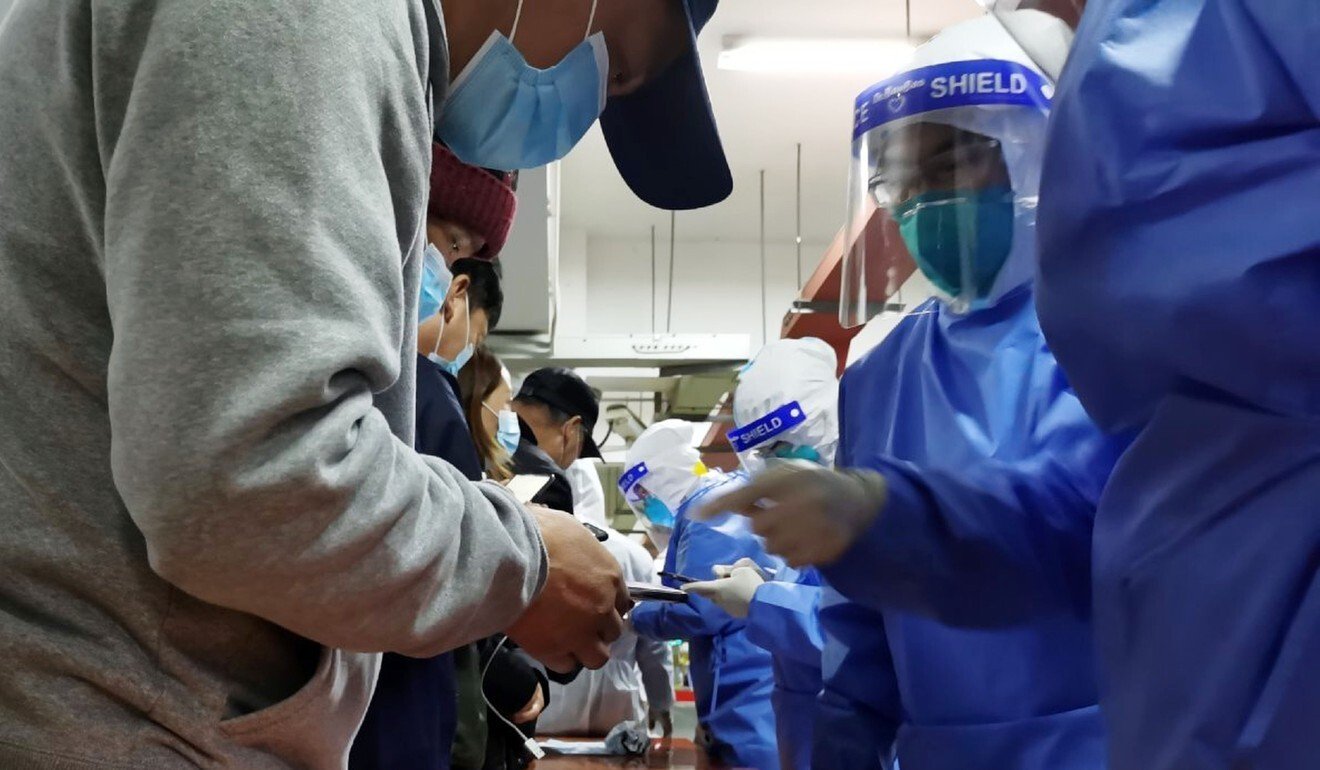 a group of people wearing face masks and gloves