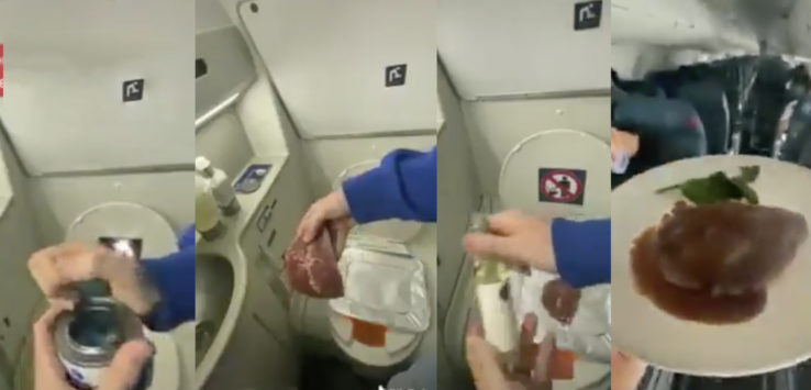 a person holding a bag of meat in a bathroom