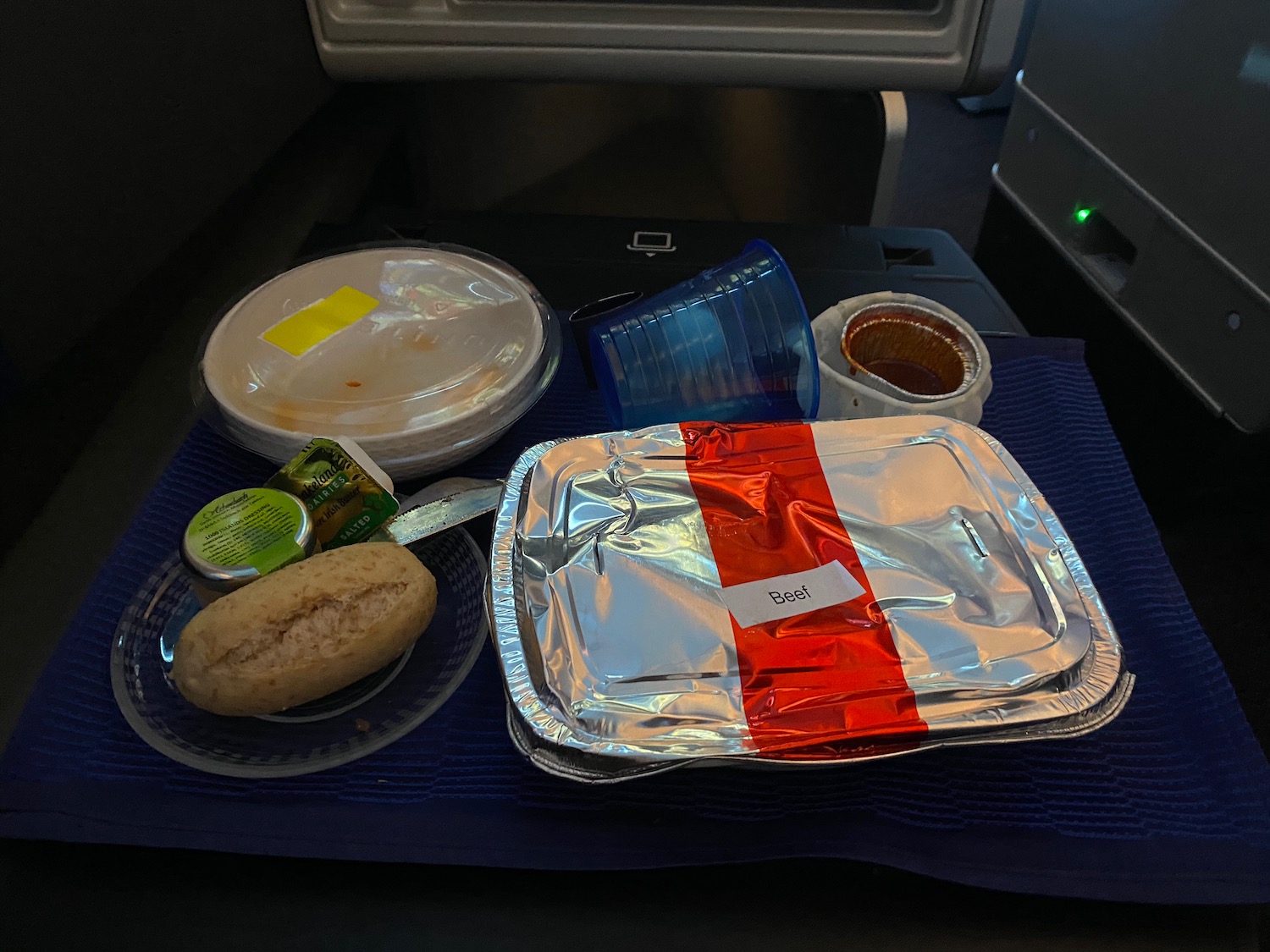 a plate of food on a blue mat