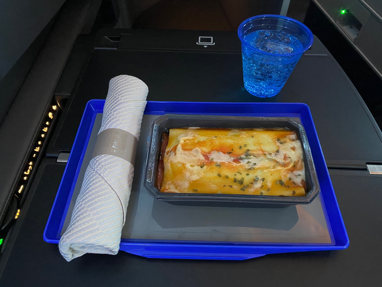 a tray of food and a napkin on a tray