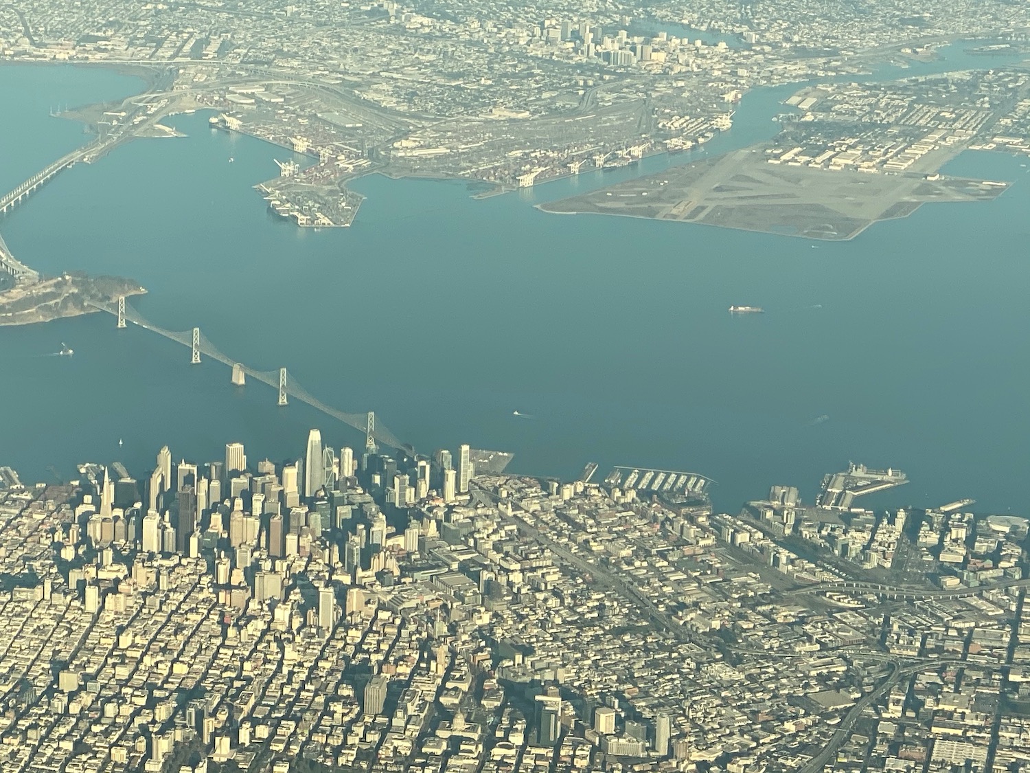 an aerial view of a city and a body of water