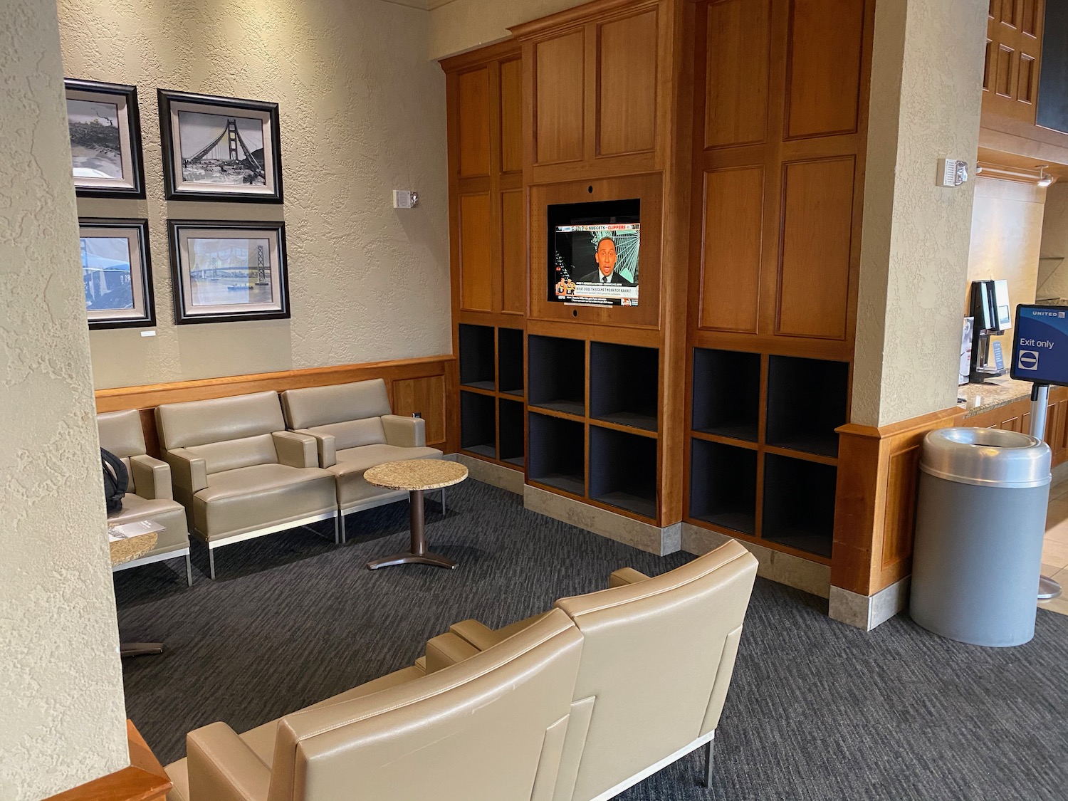 a room with a television and shelves