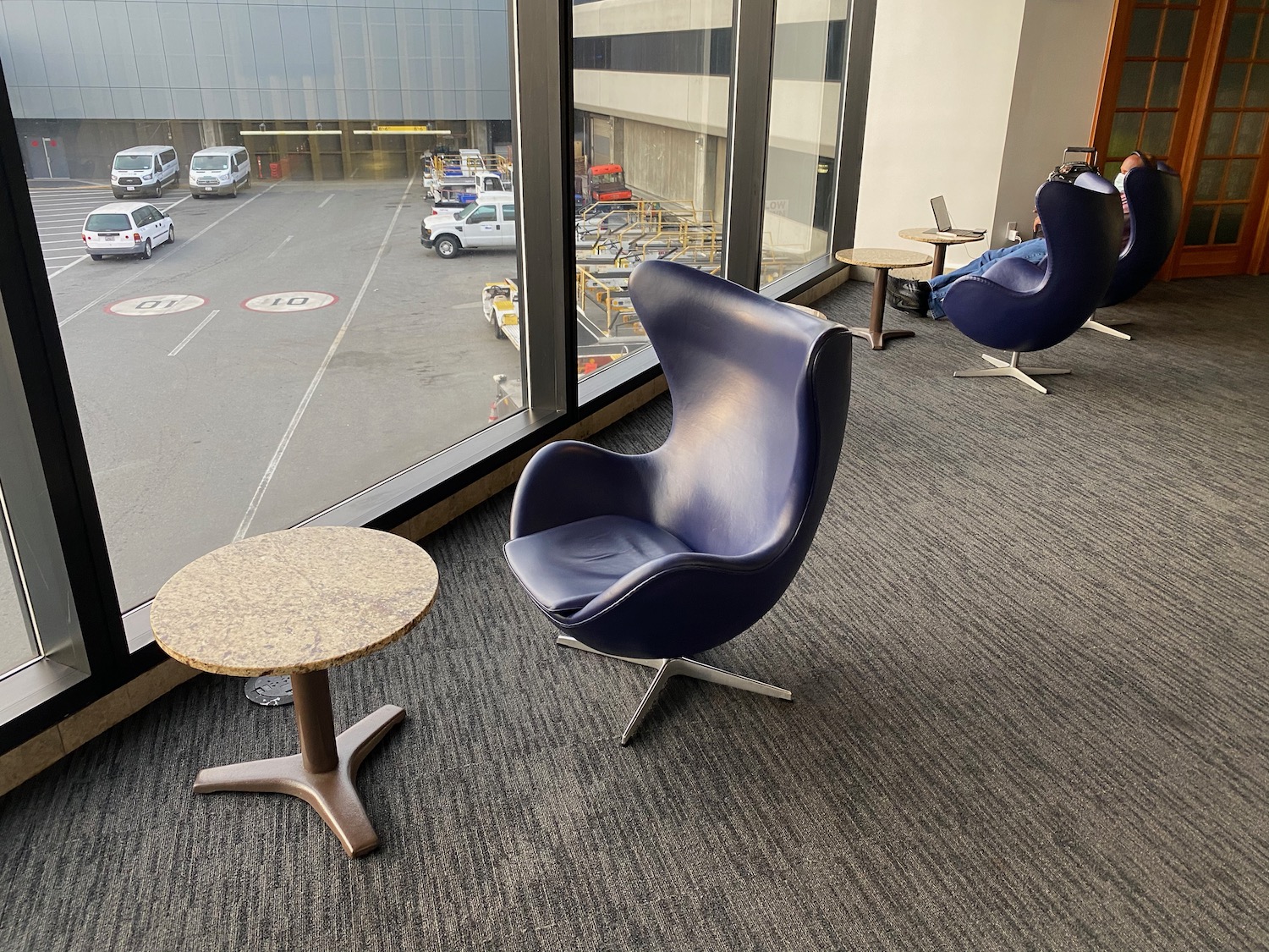 a chair and table in a room with windows