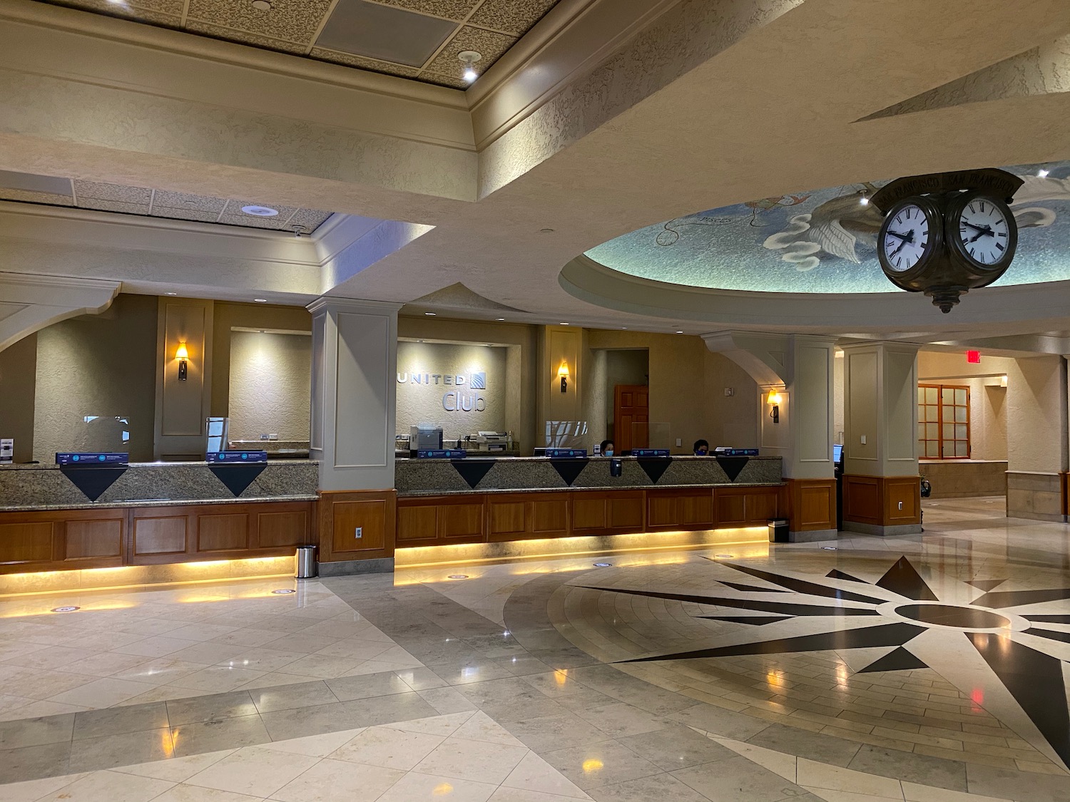 a large lobby with a clock and counter