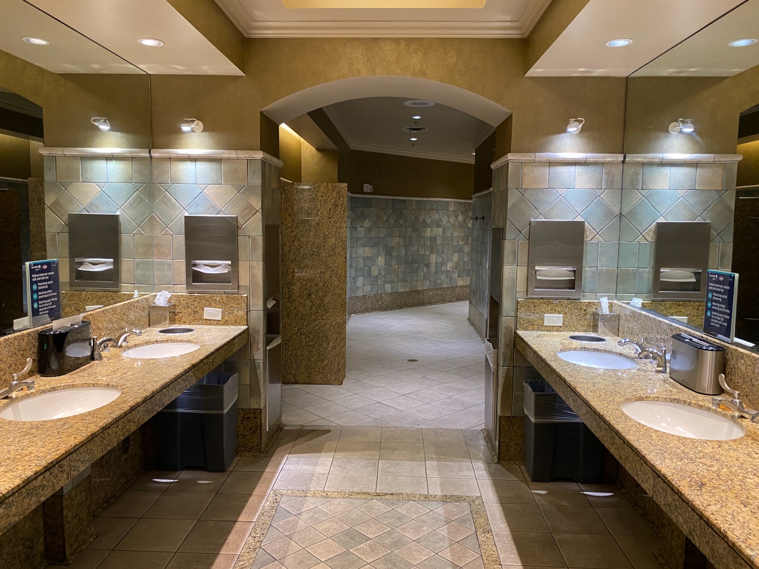 a bathroom with sinks and mirrors