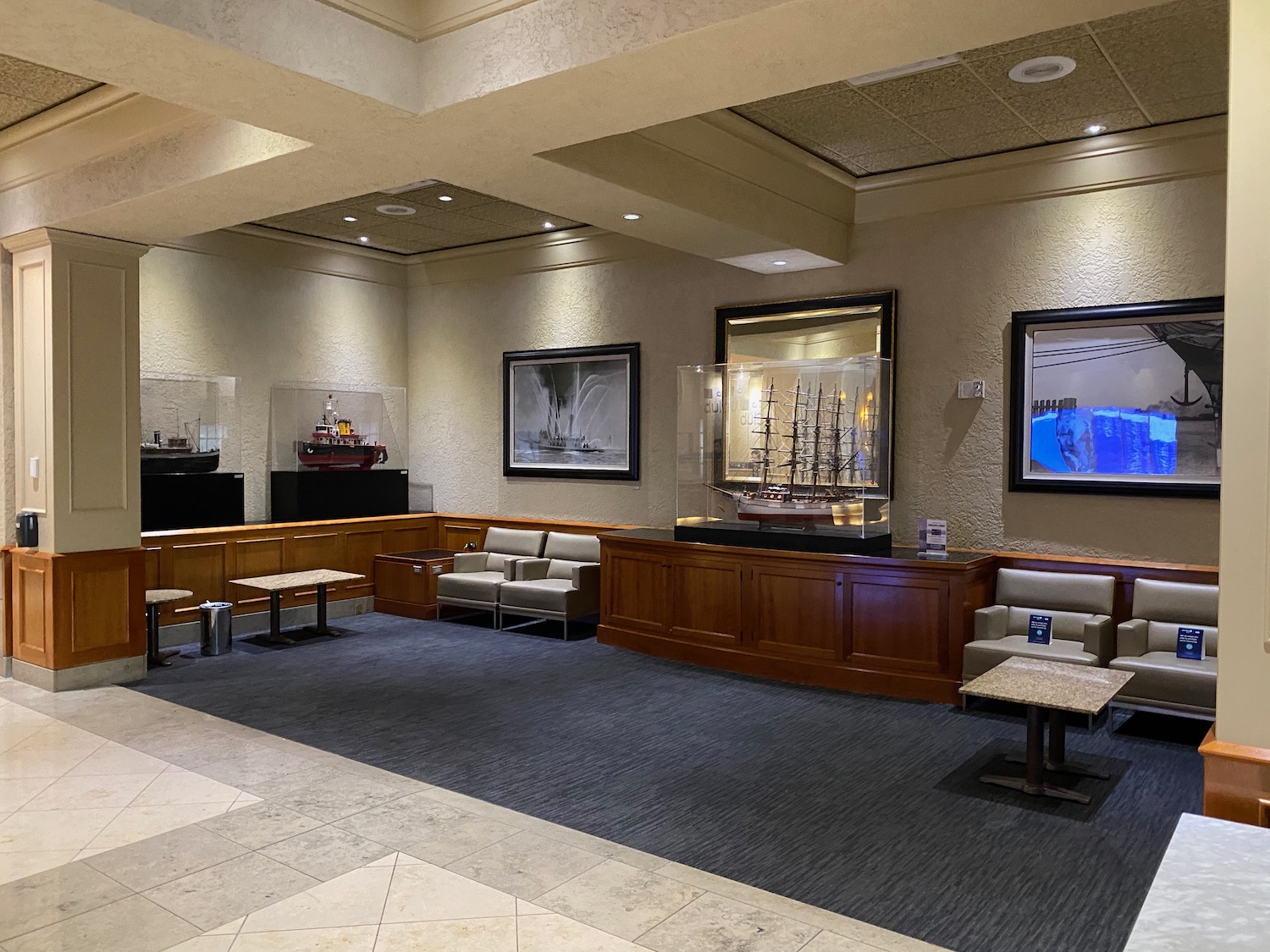 a room with a large display case and a table