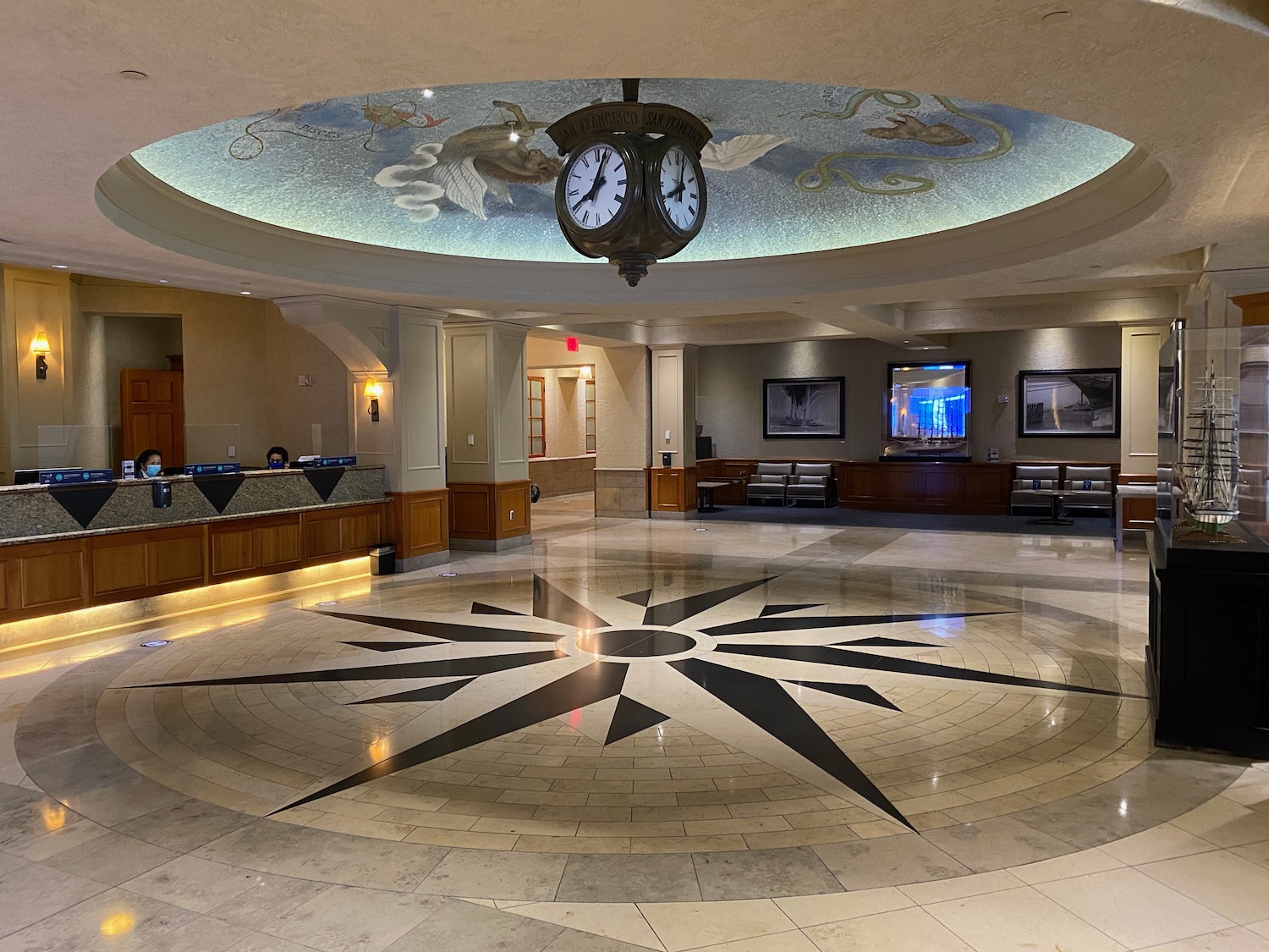 a large room with a clock and a circular floor