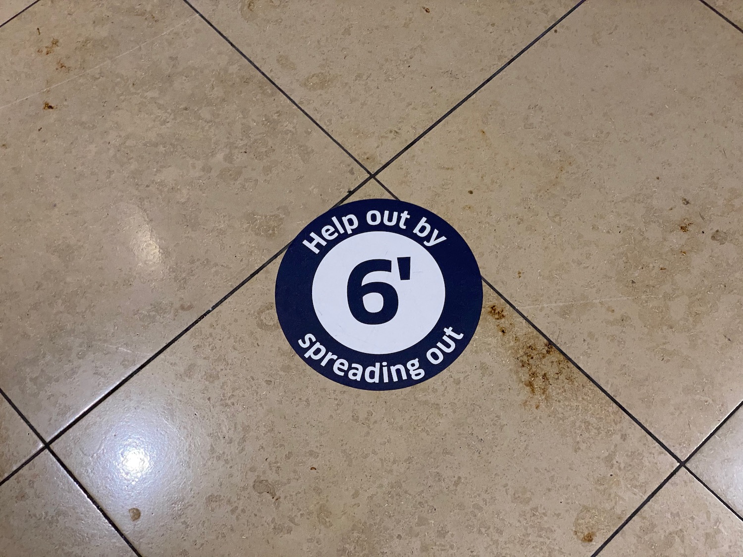 a sticker on a tile floor