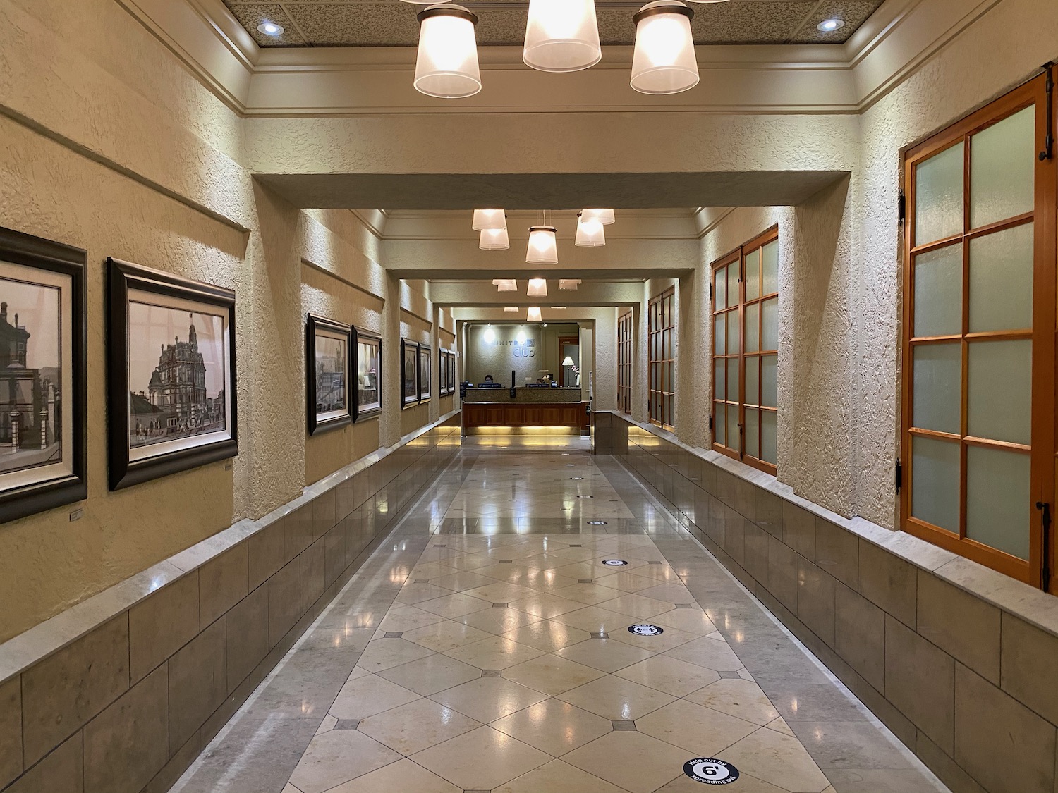 a hallway with pictures on the wall