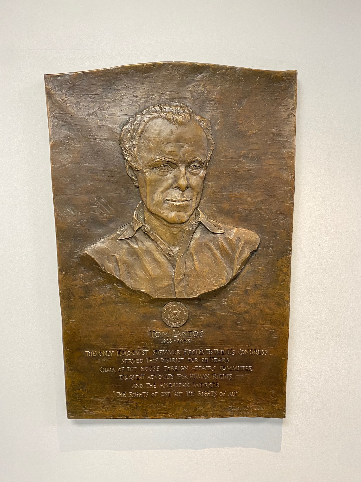 a plaque with a man's face
