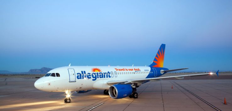 a white airplane on a runway