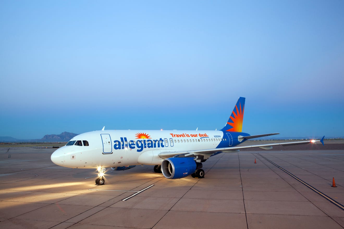 a white airplane on a runway