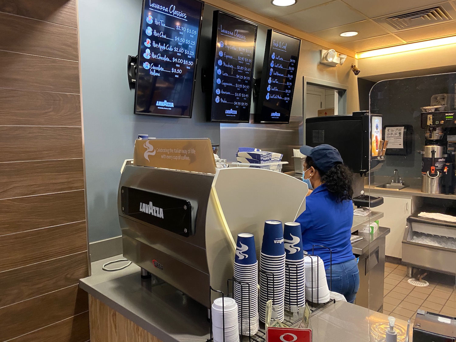 a woman at a counter in a fast food restaurant