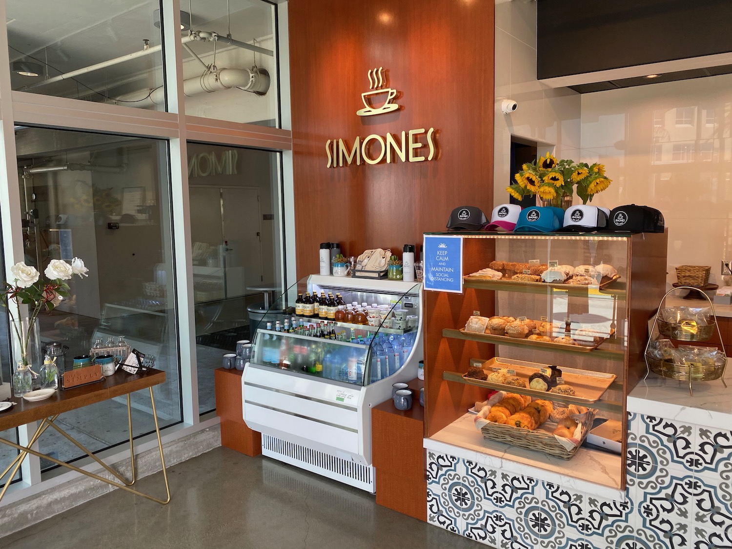 a display case of pastries and drinks