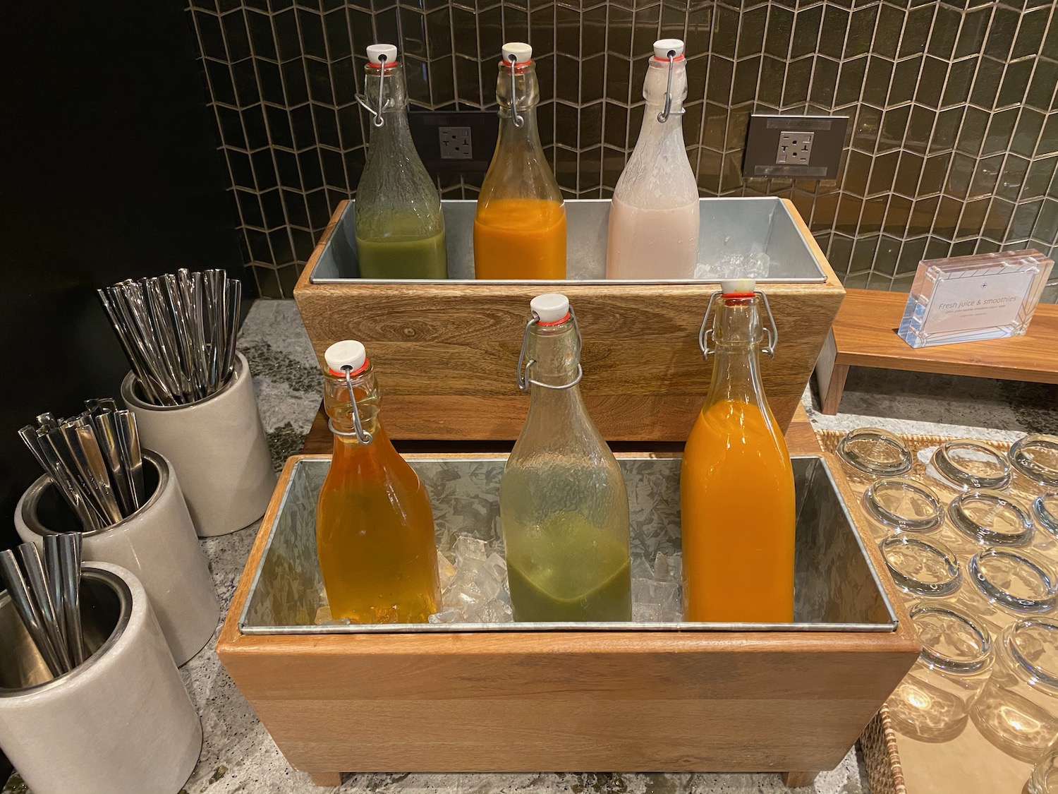 bottles of liquid in a wooden container