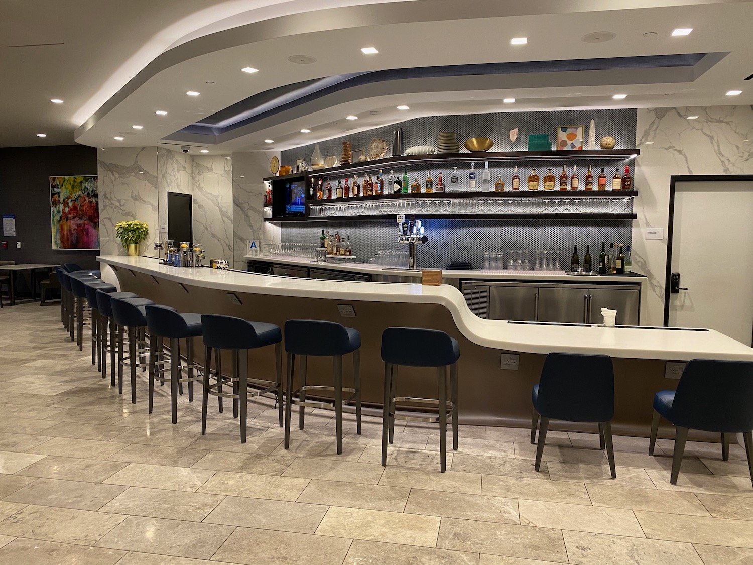 a bar with a counter and chairs