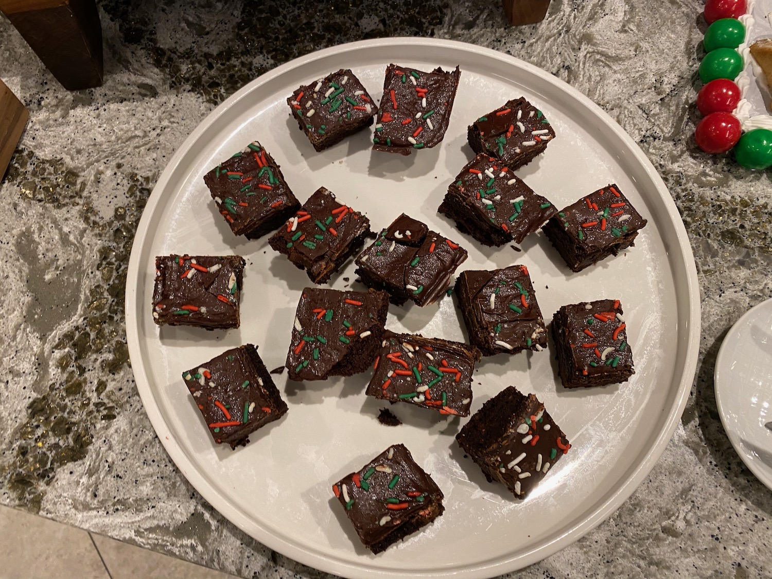 a plate of brownies with sprinkles on it