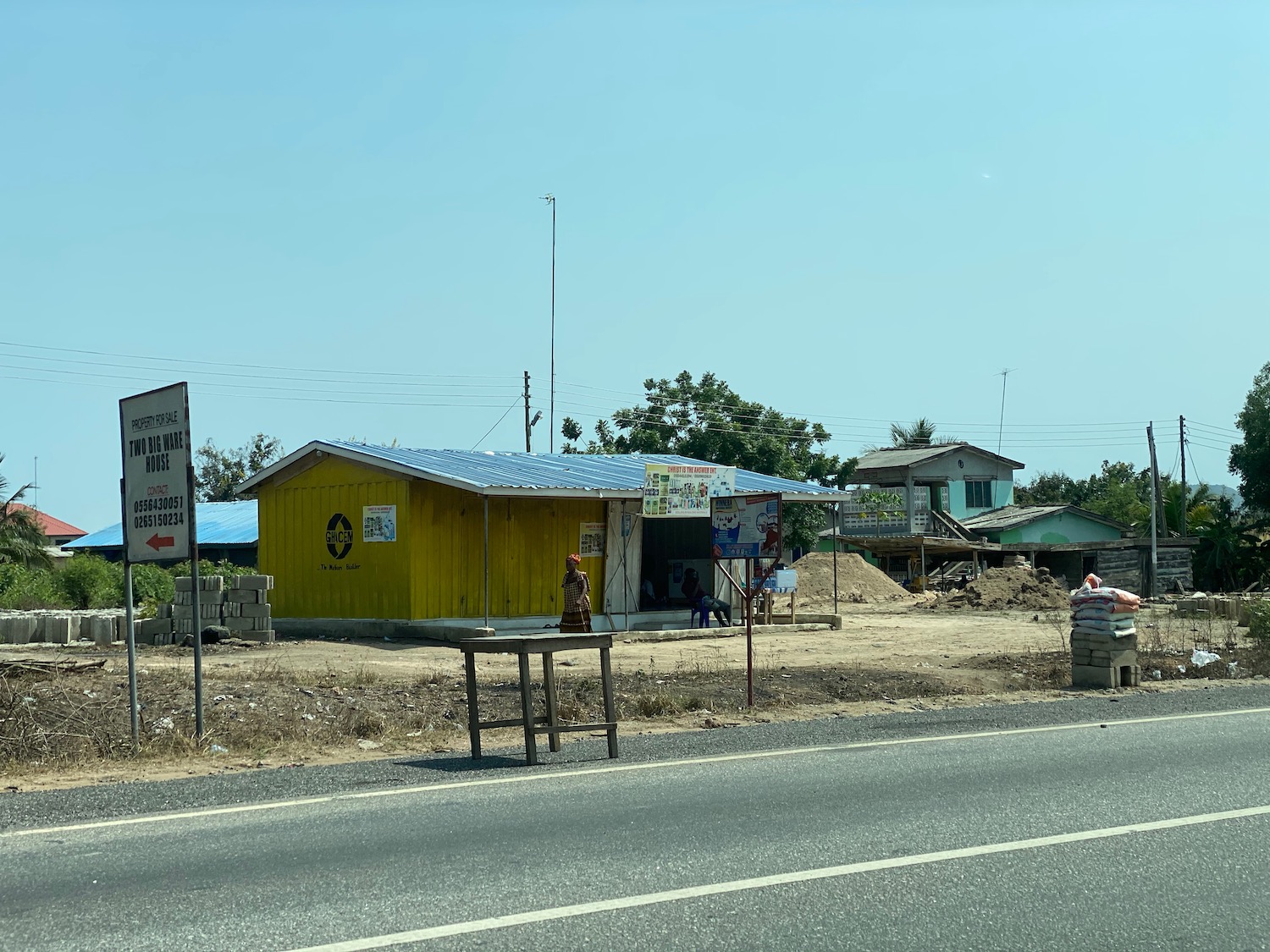 a yellow building next to a road