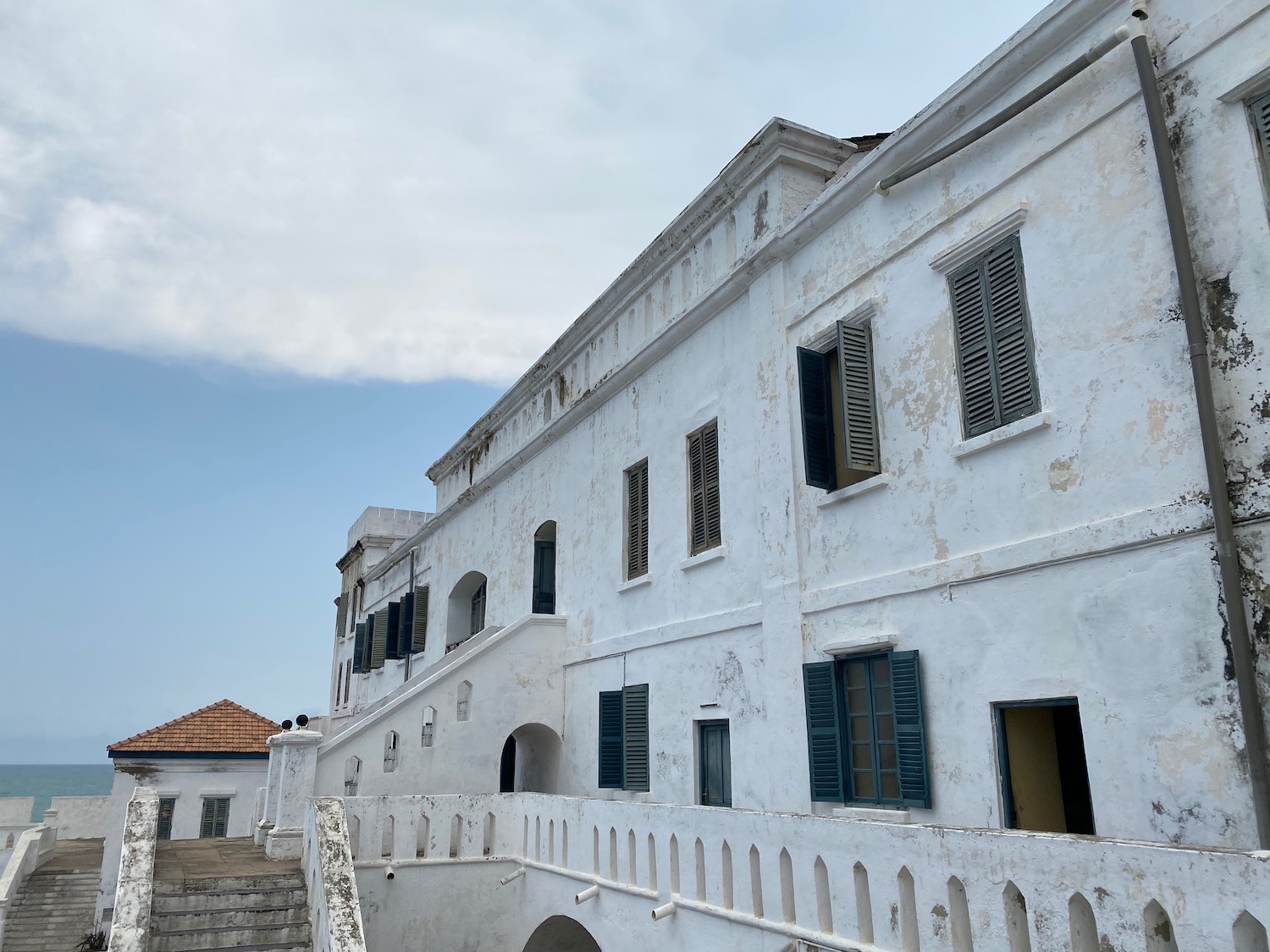 a white building with blue shutters