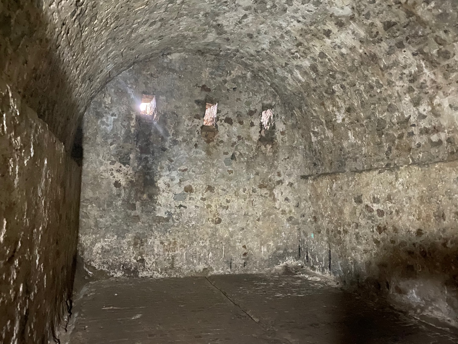 a stone room with windows