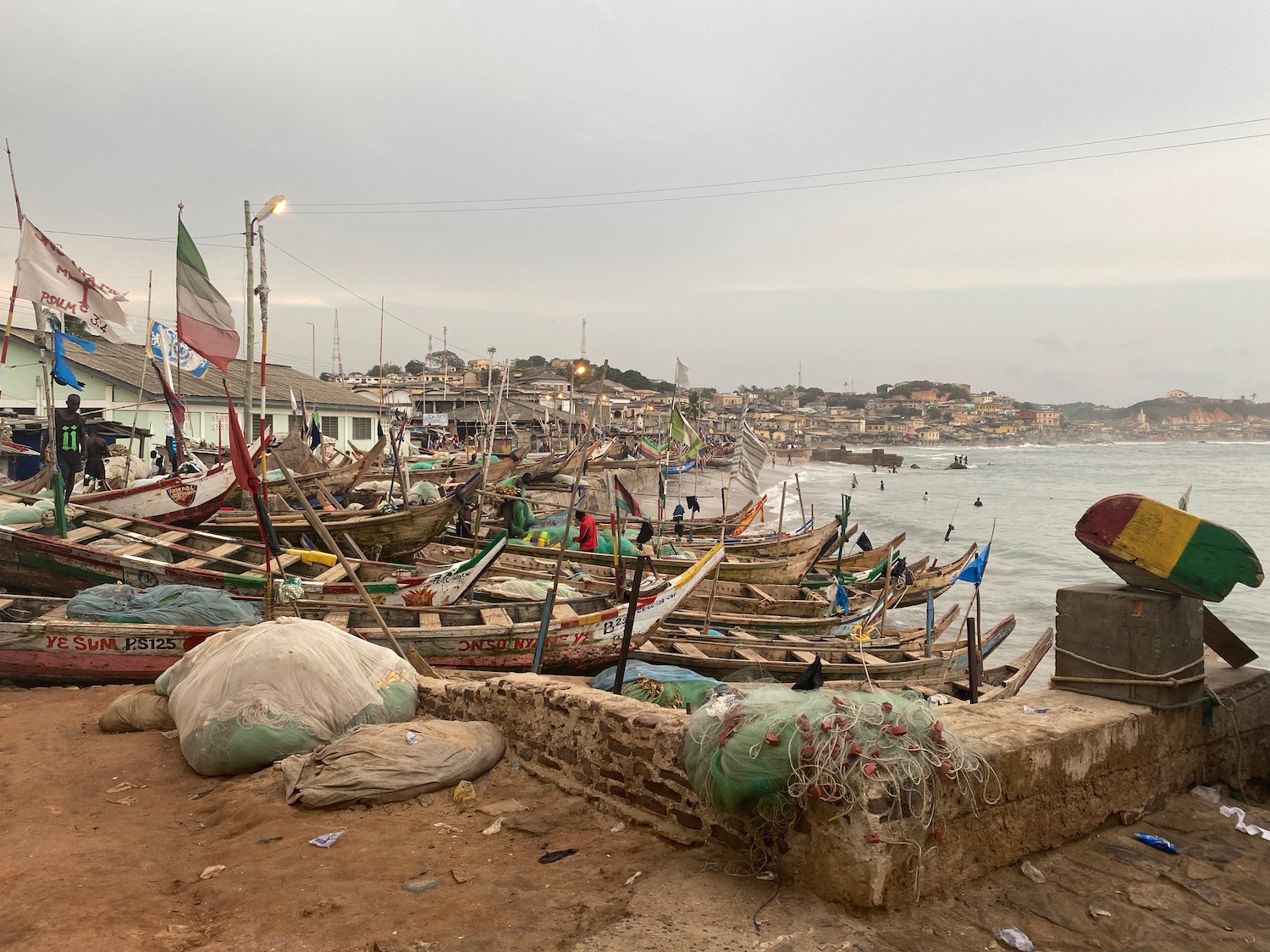 a group of boats on a beach