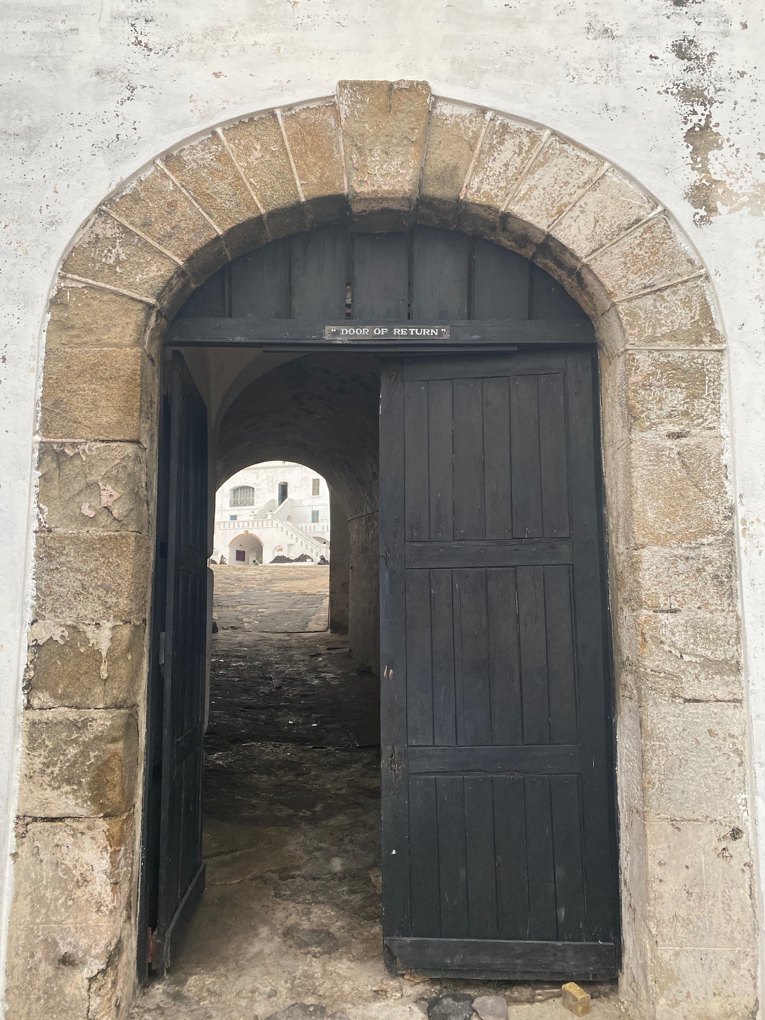 a doorway with a stone arch