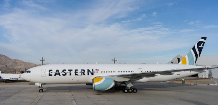 a large white airplane on a runway