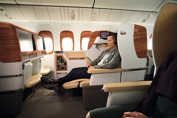 a man sitting in a chair in an airplane