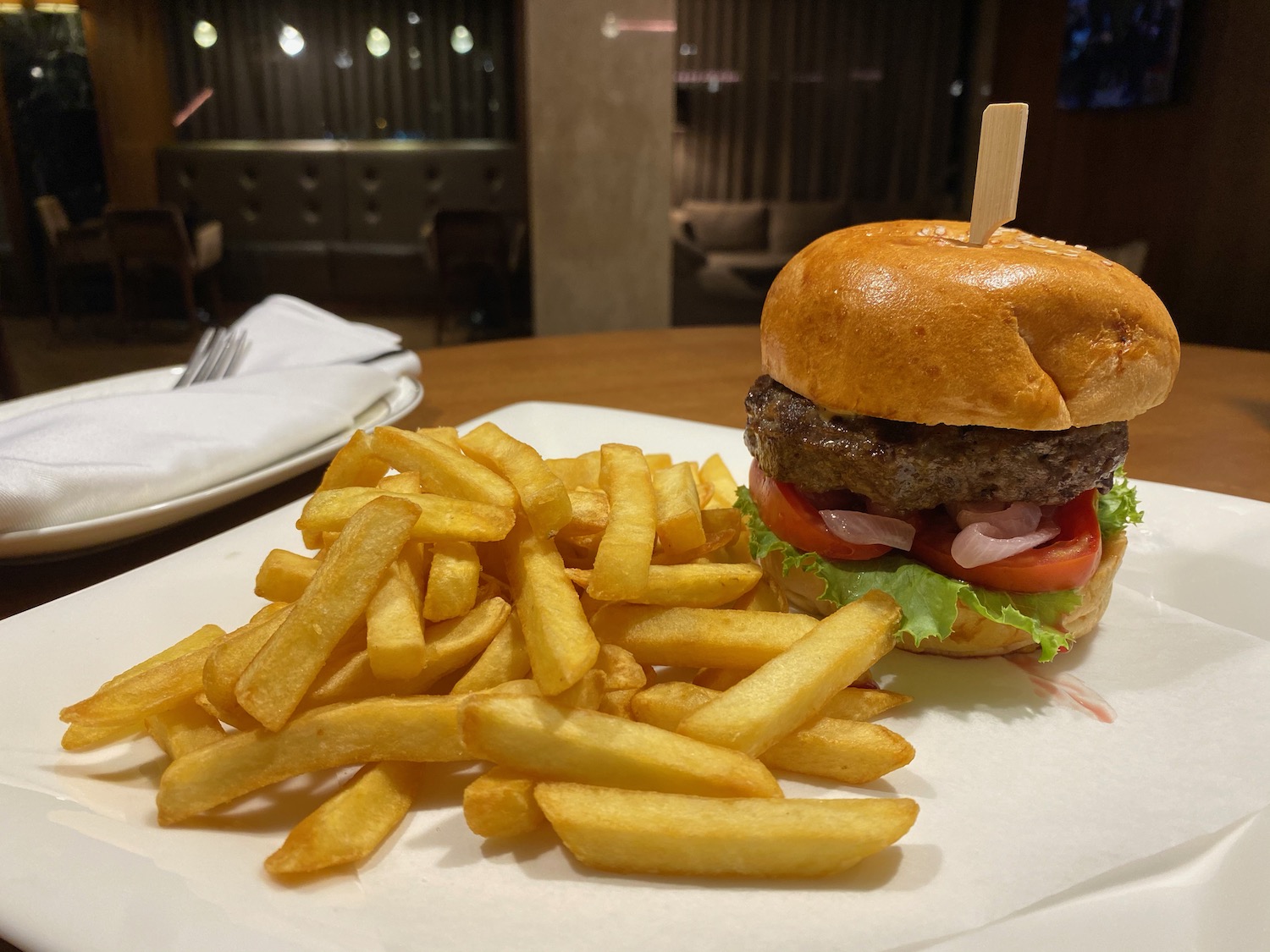 a burger and fries on a plate