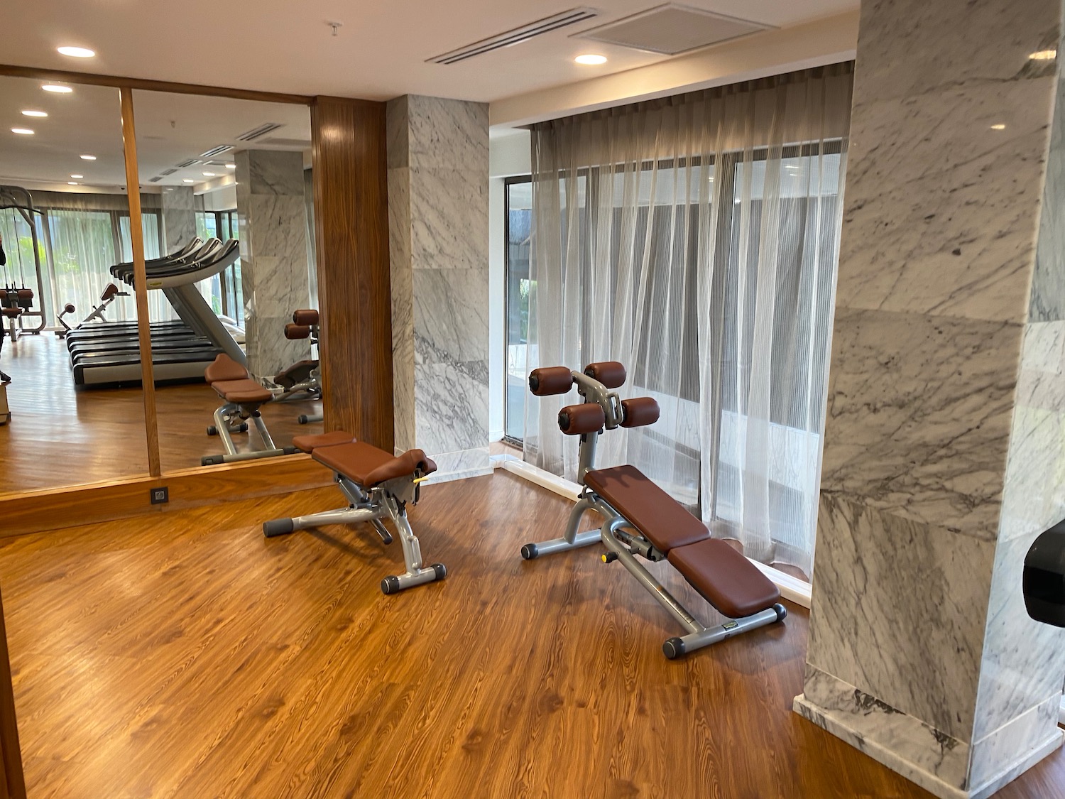 a gym with a mirror and exercise equipment