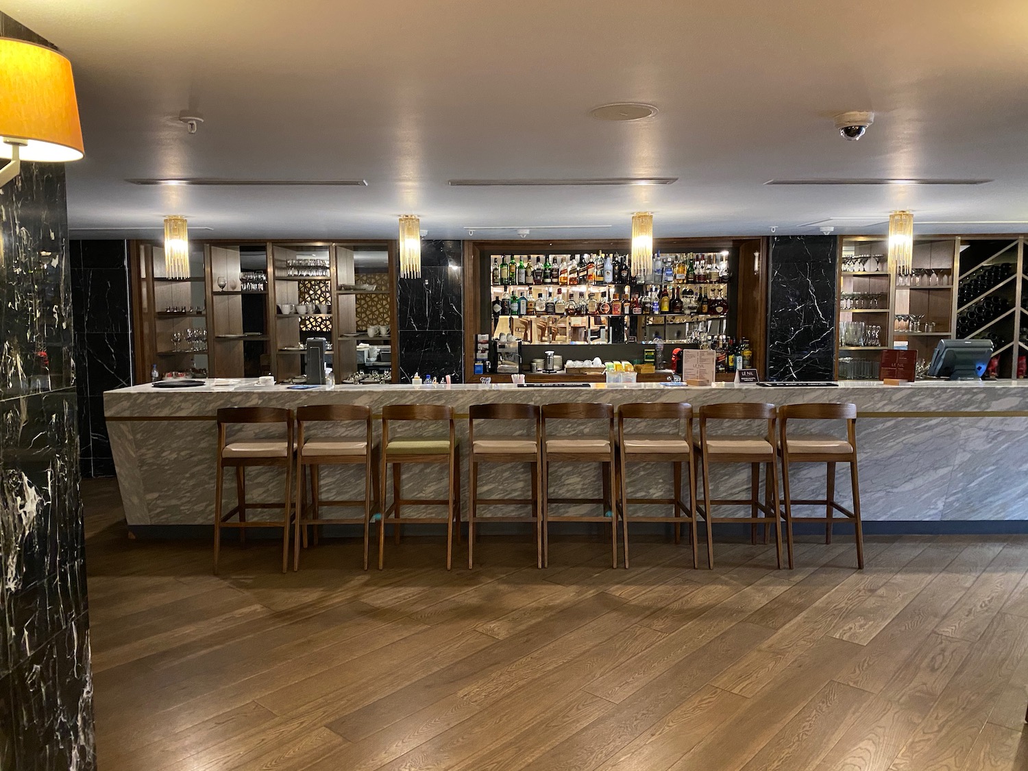 a bar with chairs and a counter