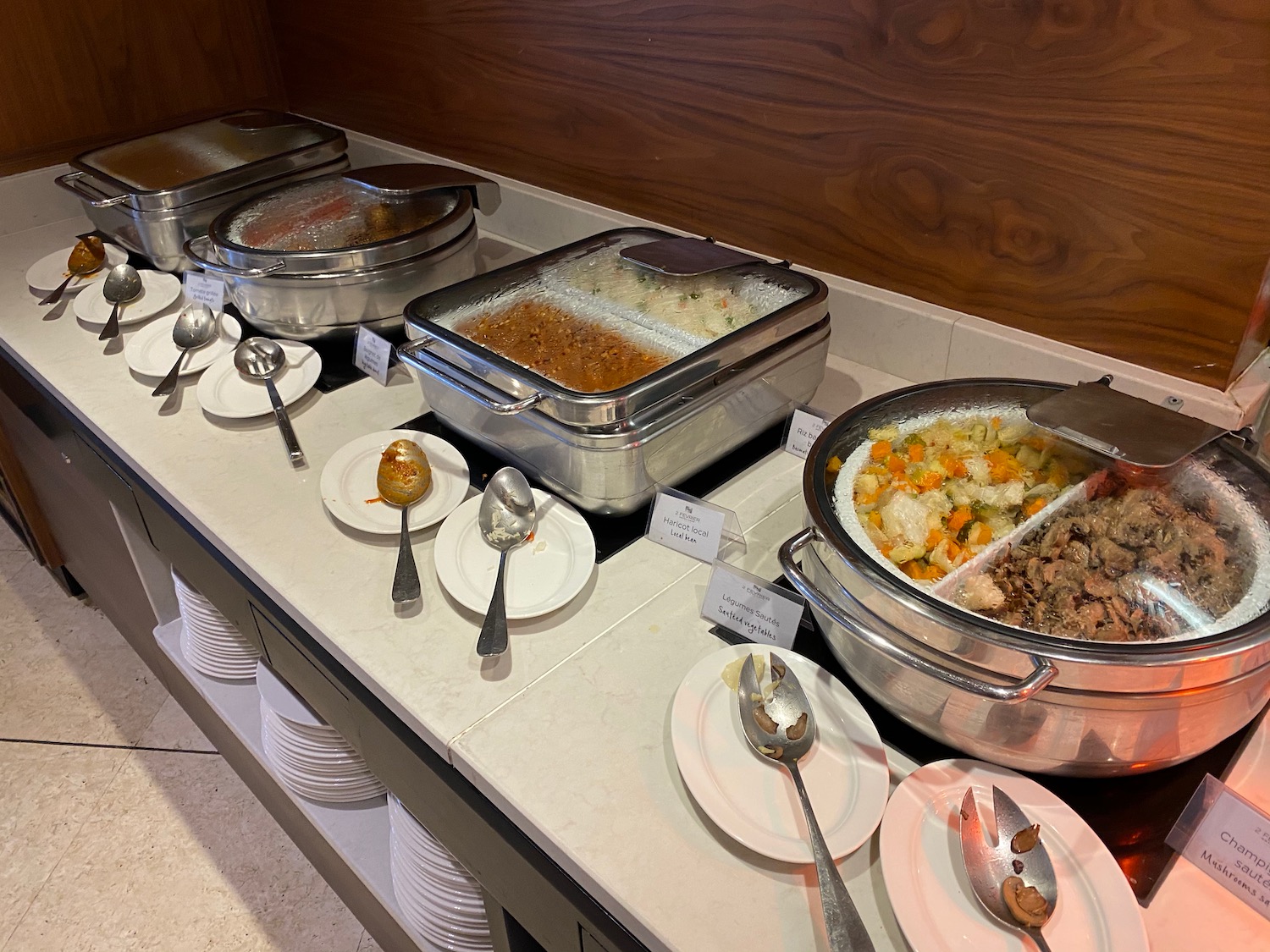 a buffet table with food in containers