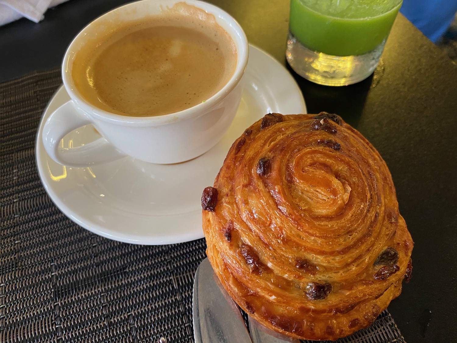 a pastry and a cup of coffee