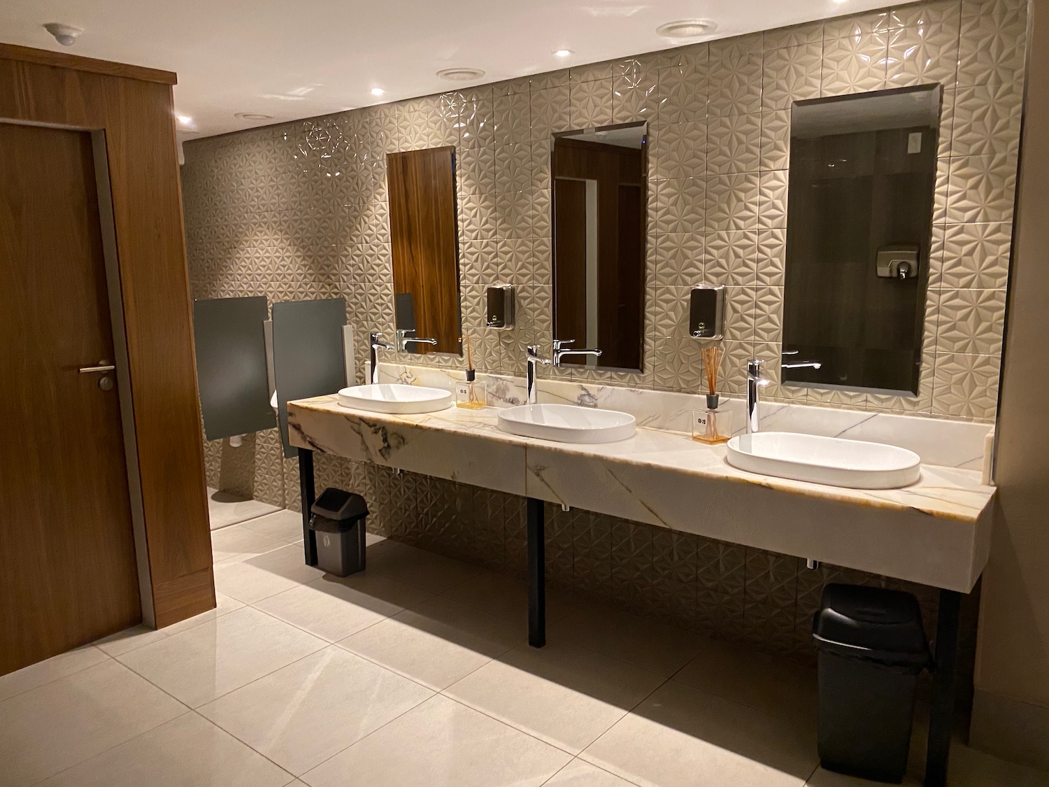 a bathroom with sinks and mirrors