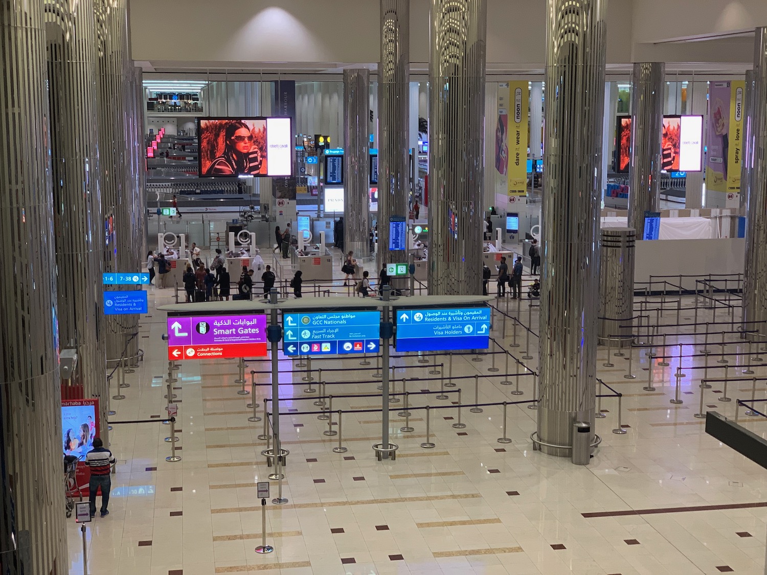 a large hall with many columns and signs