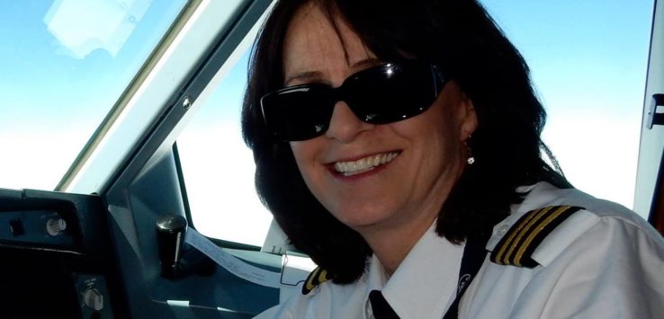 a woman in a uniform smiling