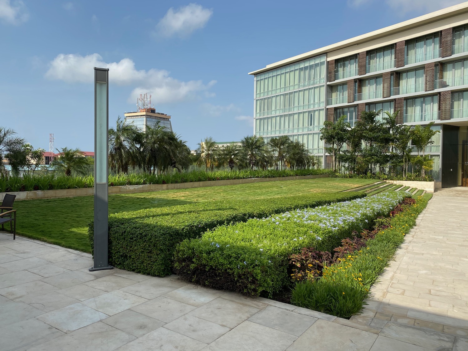 a building with a lawn and bushes