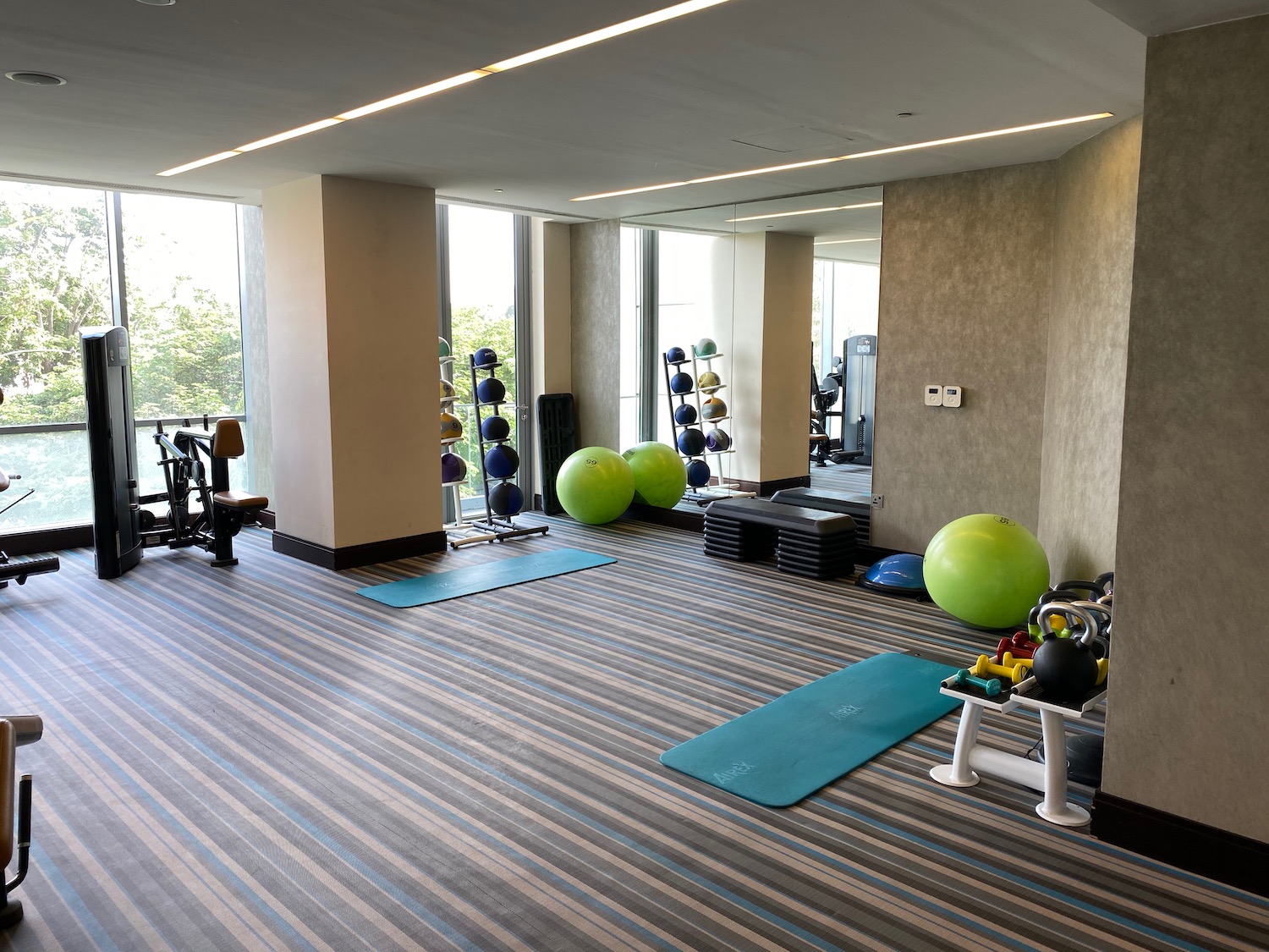 a room with exercise equipment and exercise equipment